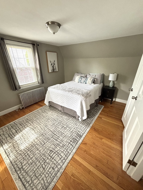 253 Gillette Avenue Springfield, MA 01118 - Photo 17 of 26 a bedroom with a bed lamp and a window