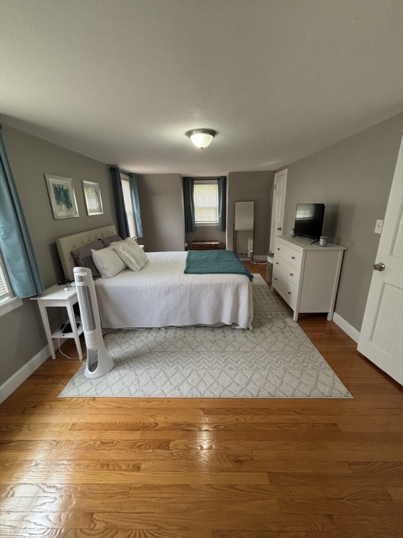 253 Gillette Avenue Springfield, MA 01118 - Photo 20 of 26 a living room with furniture and a flat screen tv