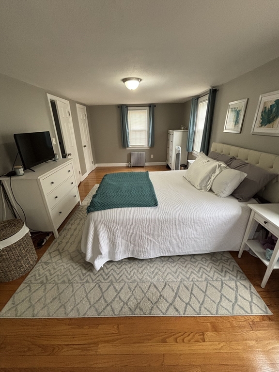 253 Gillette Avenue Springfield, MA 01118 - Photo 21 of 26 a bedroom with a bed and a flat tv screen on dresser