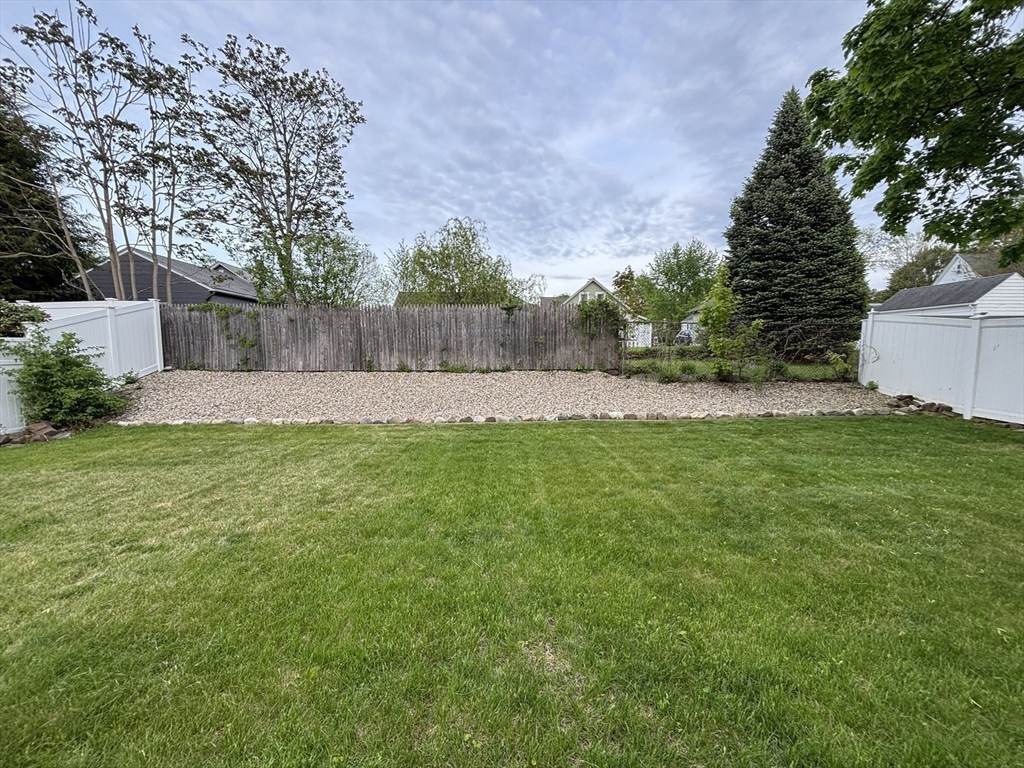 253 Gillette Avenue Springfield, MA 01118 - Photo 25 of 26 a view of yard with grass and trees