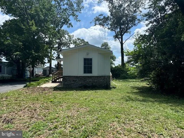a kitchen with a refrigerator and a stove top oven
