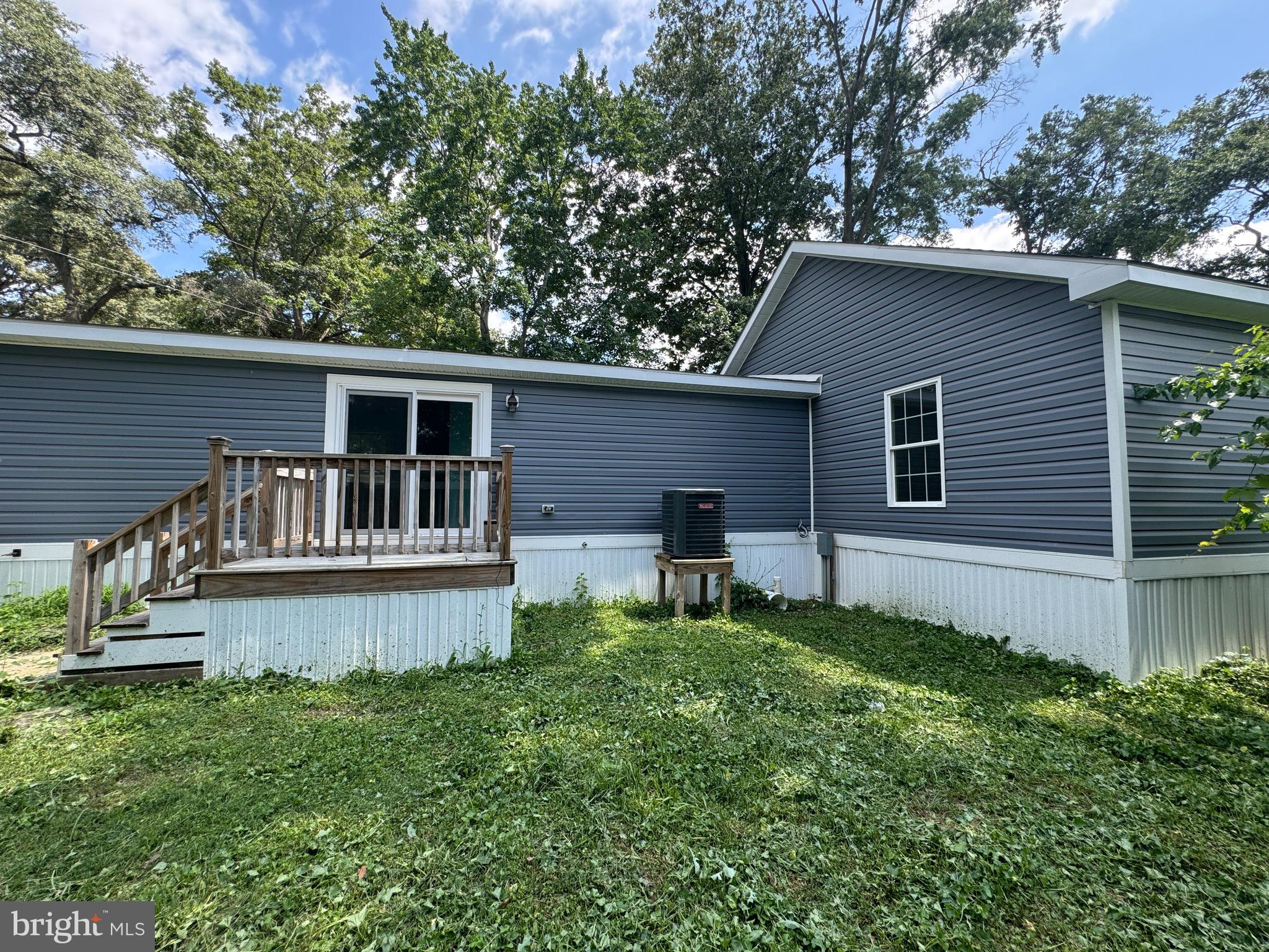 10130 Cherry Street Laurel, DE 19956 - Photo 9 of 47 a view of a house with a yard and sitting area