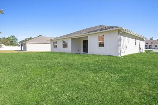 a front view of a house with yard