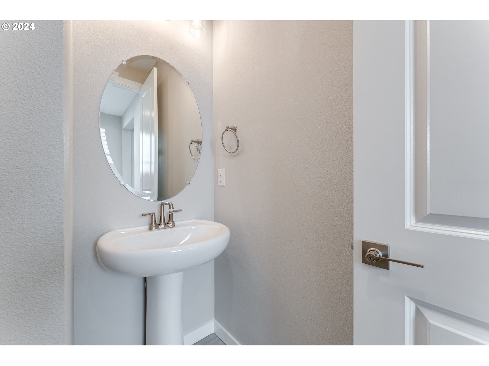 737 Northwest 178th Street Ridgefield, WA 98642 - Photo 4 of 39 a bathroom with a sink and a mirror