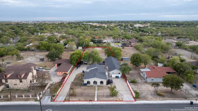 an aerial view of residential houses with outdoor space