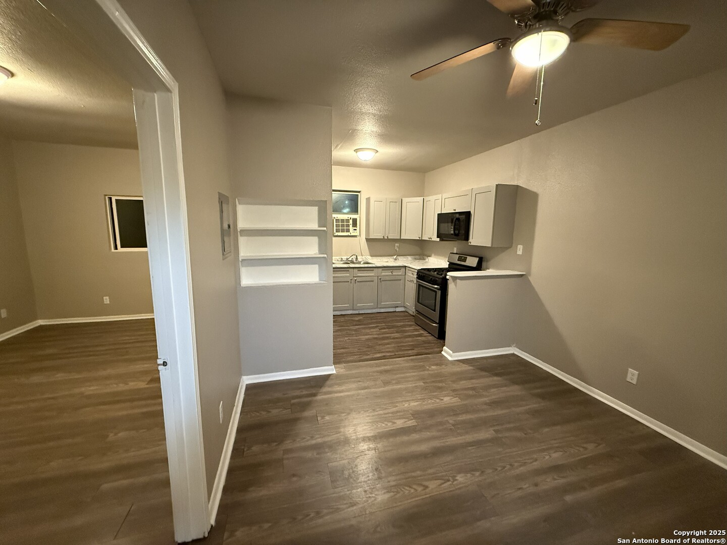 378 East Petaluma Boulevard San Antonio, TX 78221 - Photo 8 of 14 a kitchen with cabinets and wooden floor