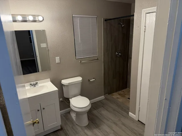 a bathroom with a toilet and a sink