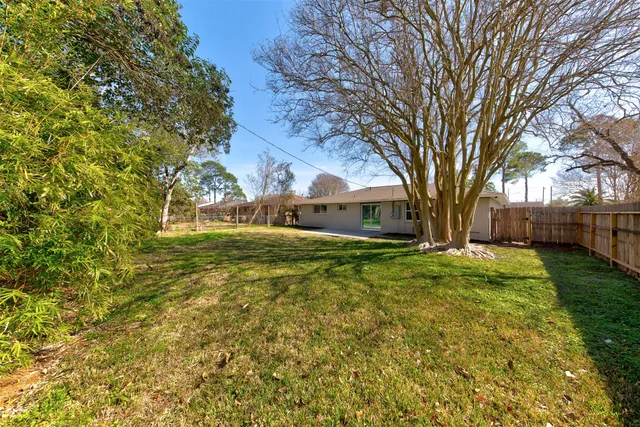 a view of a house with a tree