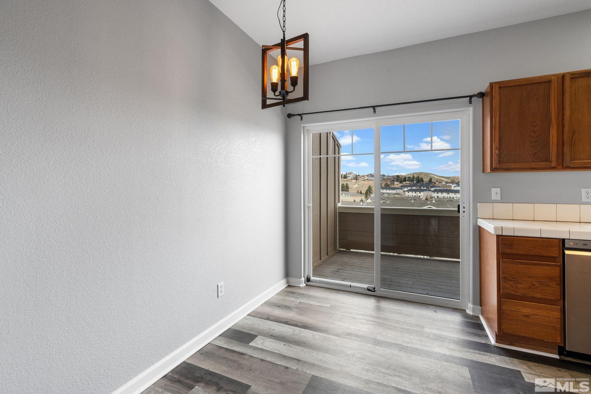 345 Madison Marie Lane Reno, NV 89503 - Photo 12 of 34 a view of a kitchen with furniture and a window