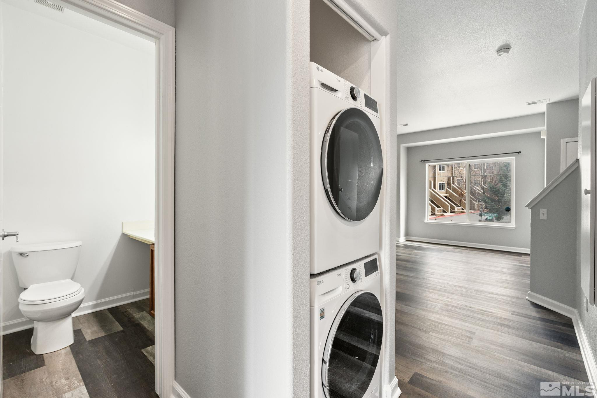 345 Madison Marie Lane Reno, NV 89503 - Photo 19 of 34 a view of a hallway with washer and dryer