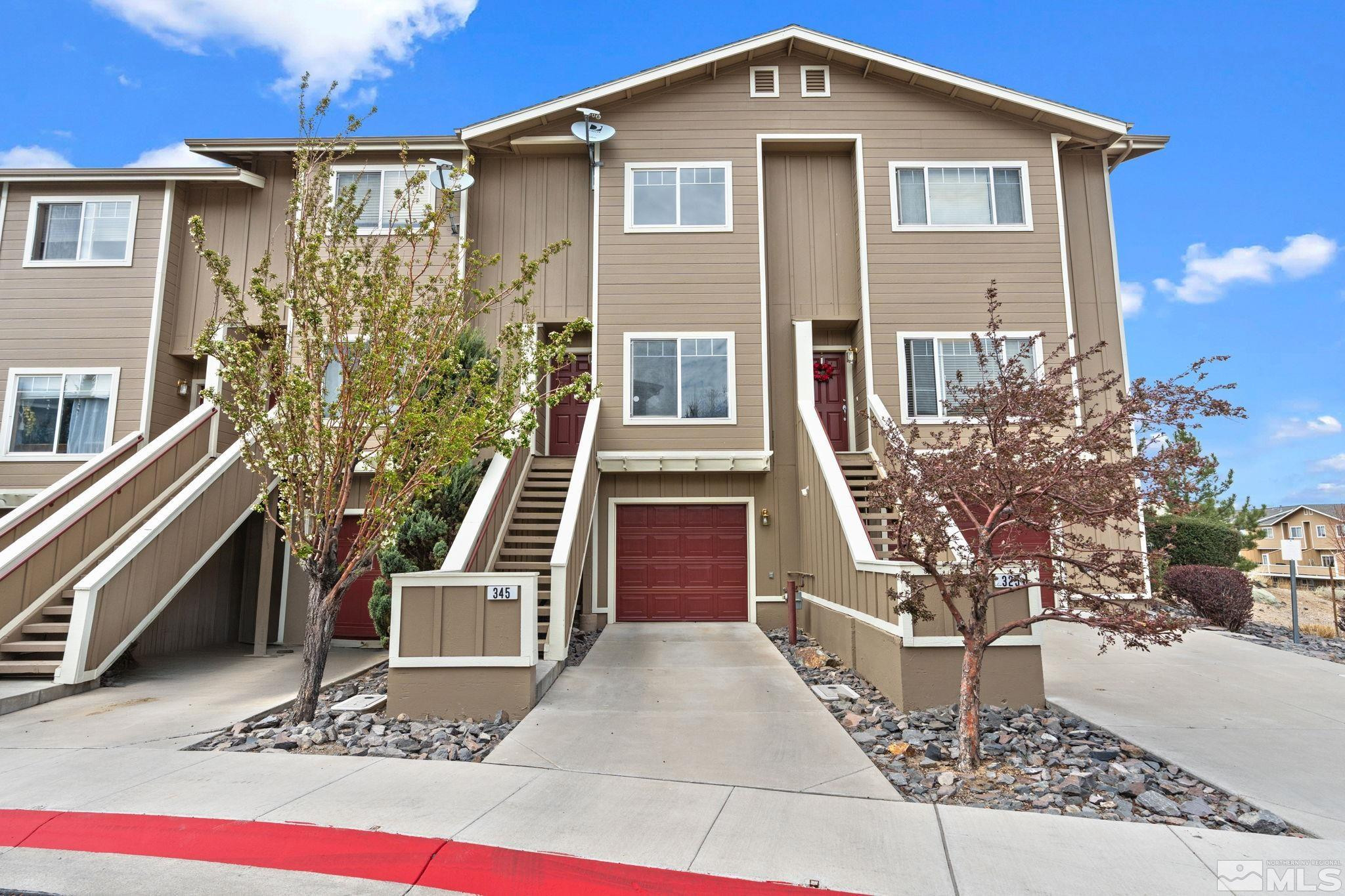 345 Madison Marie Lane Reno, NV 89503 - Photo 2 of 34 a front view of a house with stairs