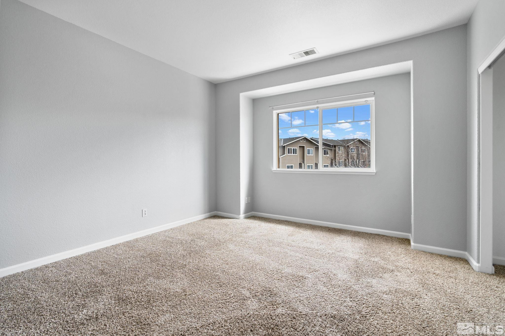 345 Madison Marie Lane Reno, NV 89503 - Photo 21 of 34 a view of an empty room with a window