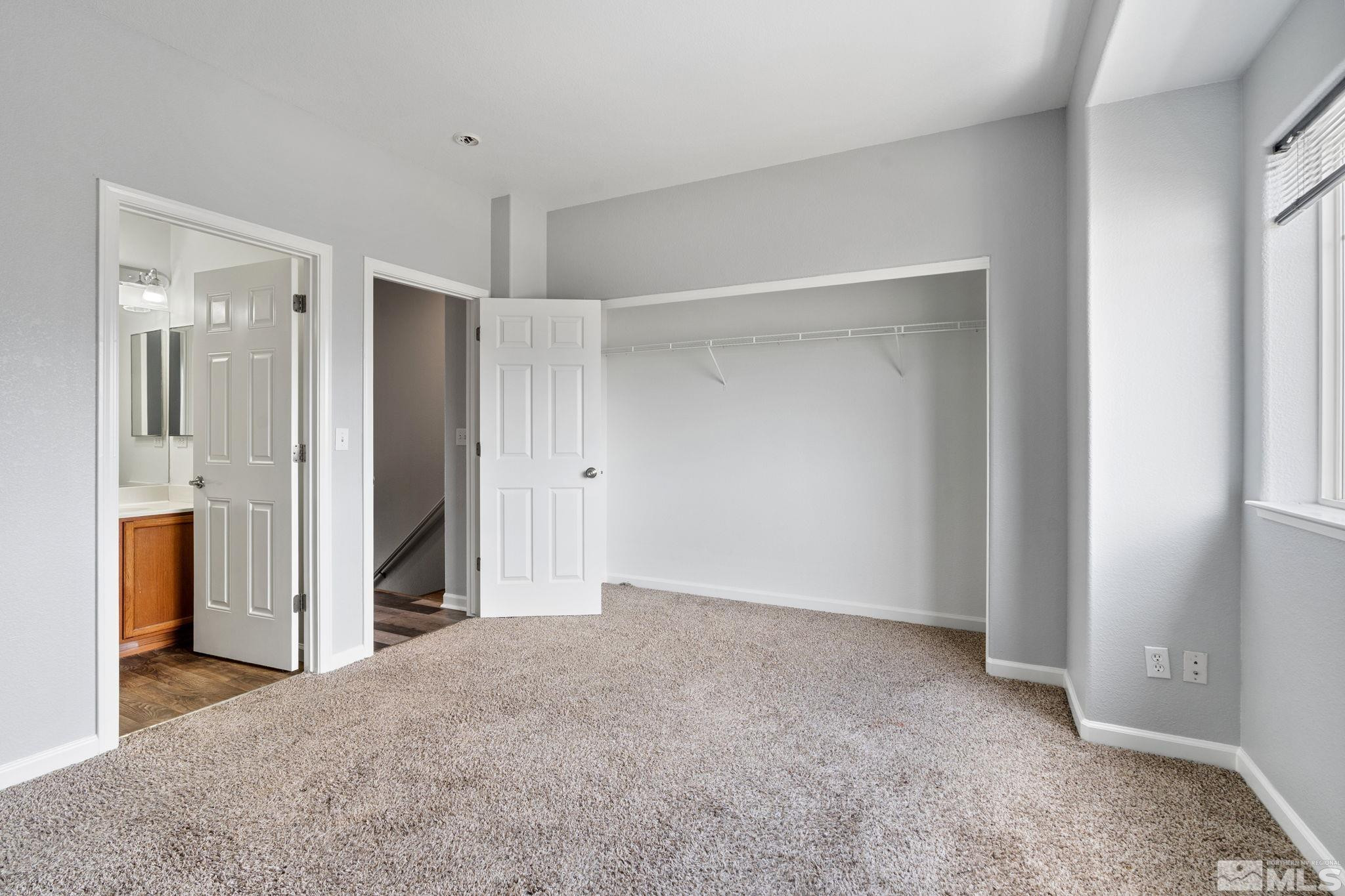 345 Madison Marie Lane Reno, NV 89503 - Photo 23 of 34 a view of a room with a walk in closet and wooden cabinet