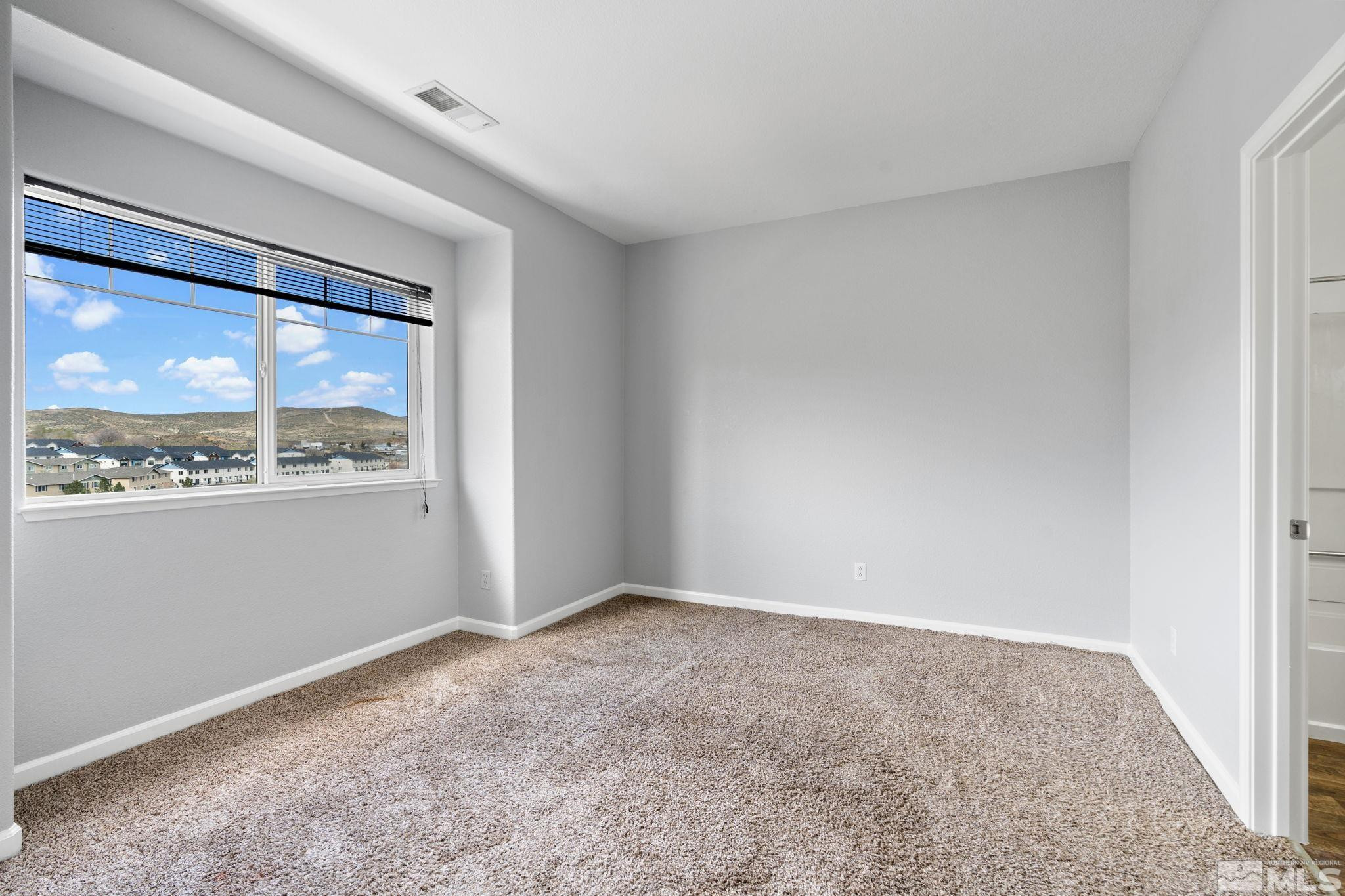 345 Madison Marie Lane Reno, NV 89503 - Photo 24 of 34 a view of an empty room with a window