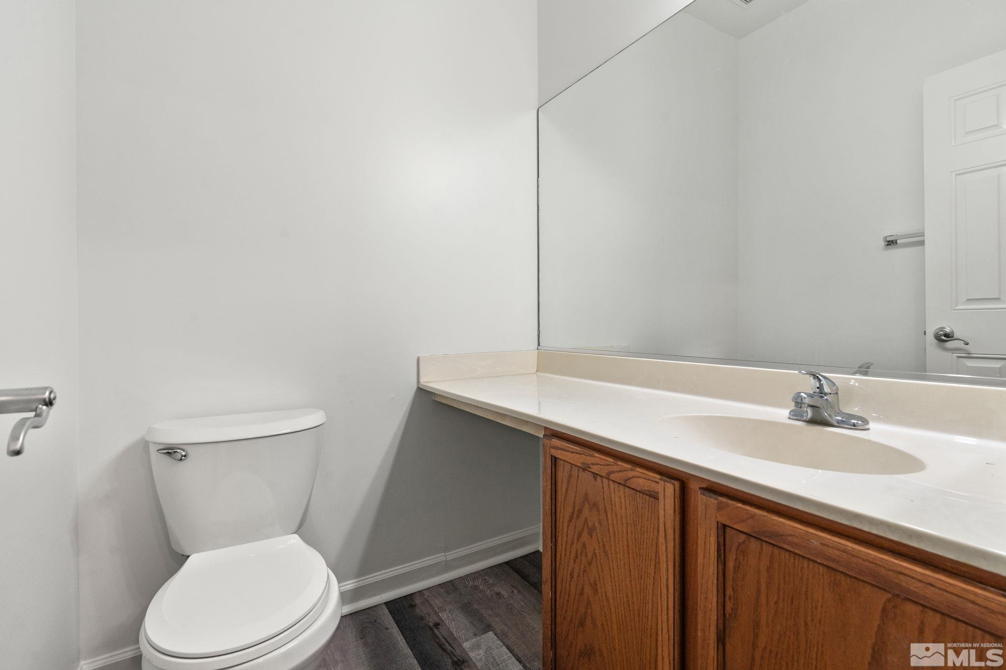 345 Madison Marie Lane Reno, NV 89503 - Photo 25 of 34 a bathroom with a sink a toilet and mirror