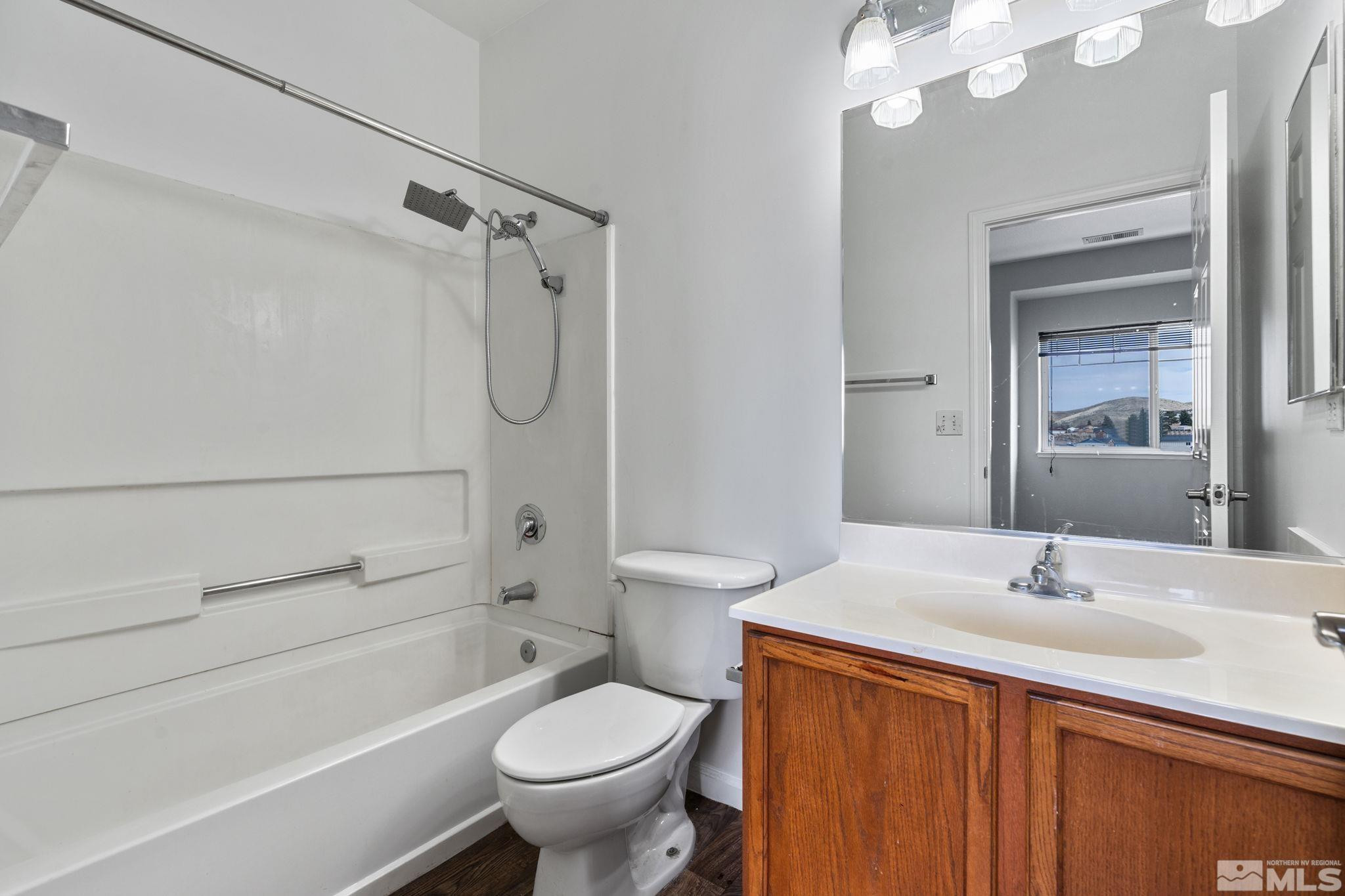 345 Madison Marie Lane Reno, NV 89503 - Photo 27 of 34 a bathroom with a sink a toilet and shower