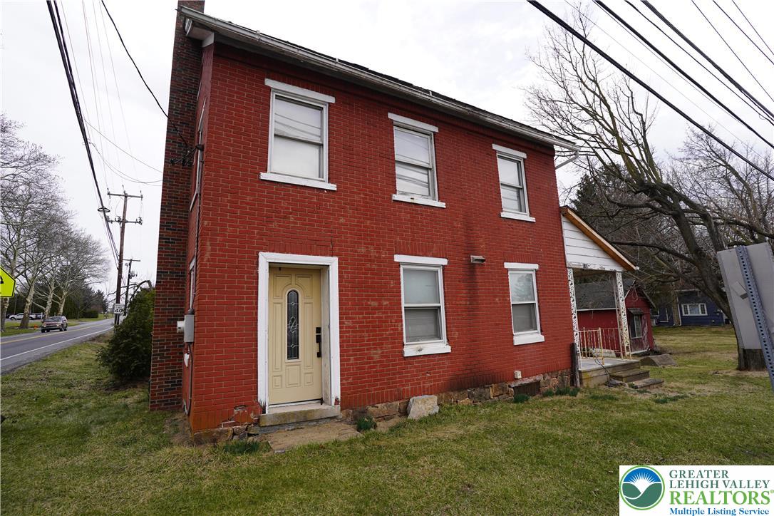 a front view of house with yard