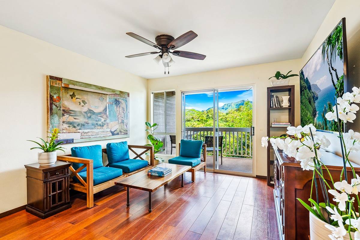 Living area to covered lanai features mountain views