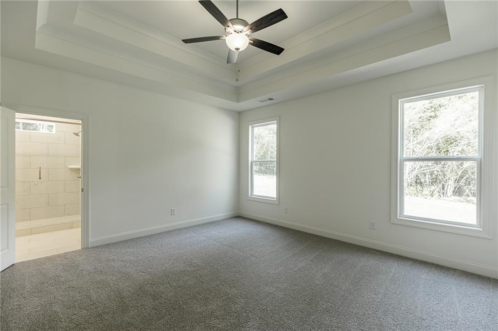 1210 Austin Road Winder, GA 30680 - Photo 33 of 56 a view of an empty room with a window
