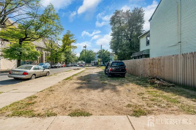 a view of street with parked cars
