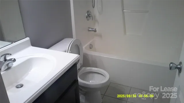 a bathroom with a sink a toilet and bathtub
