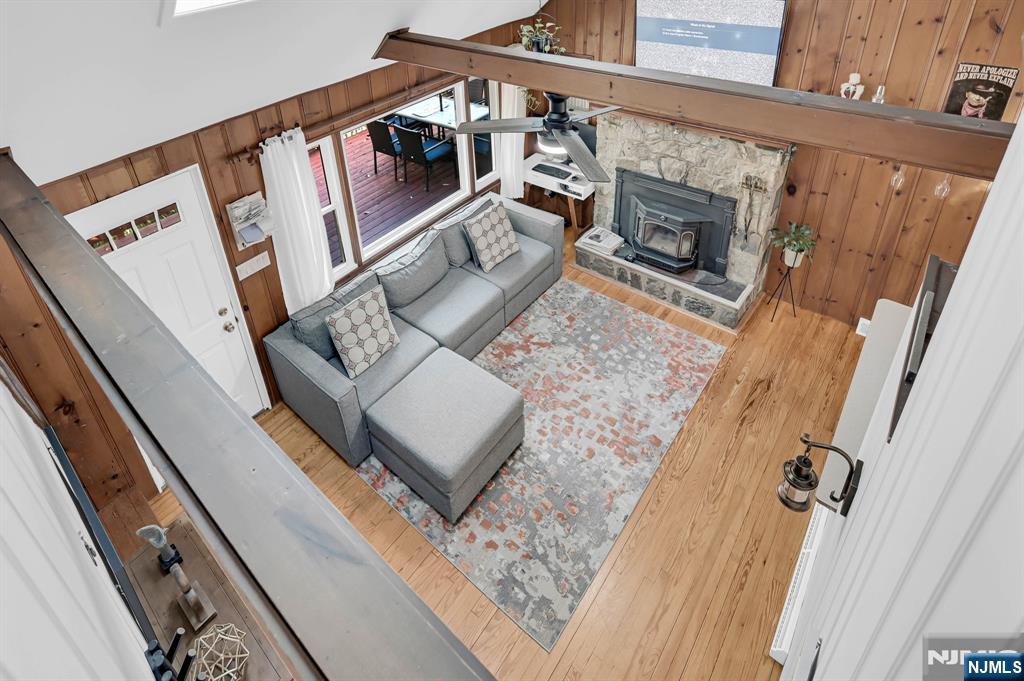 85 Breakneck Road Vernon, NJ 07422 - Photo 15 of 32 a living room with furniture and a fireplace