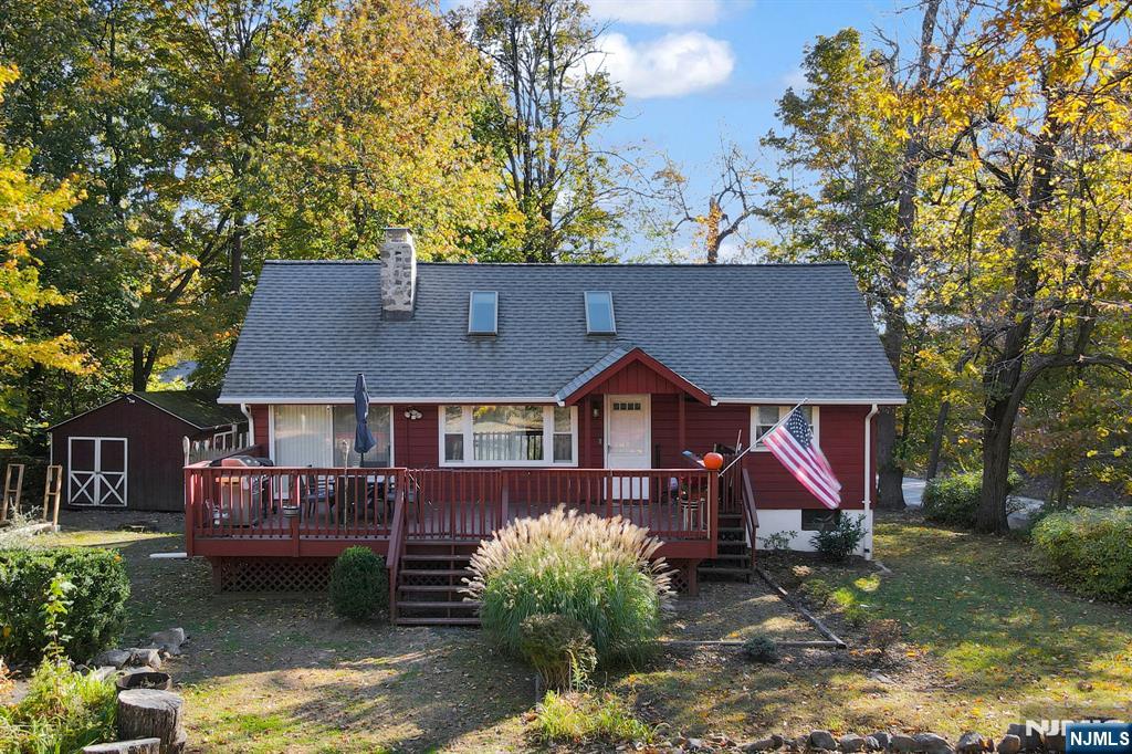 85 Breakneck Road Vernon, NJ 07422 - Photo 2 of 32 a front view of a house with a yard