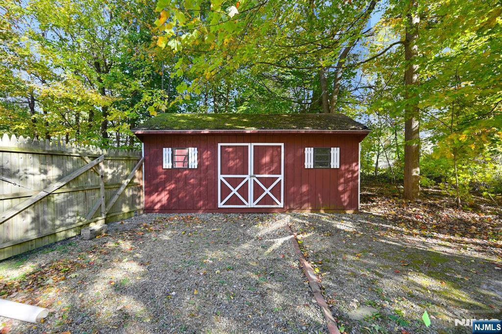 85 Breakneck Road Vernon, NJ 07422 - Photo 21 of 32 a front view of a house with yard and trees