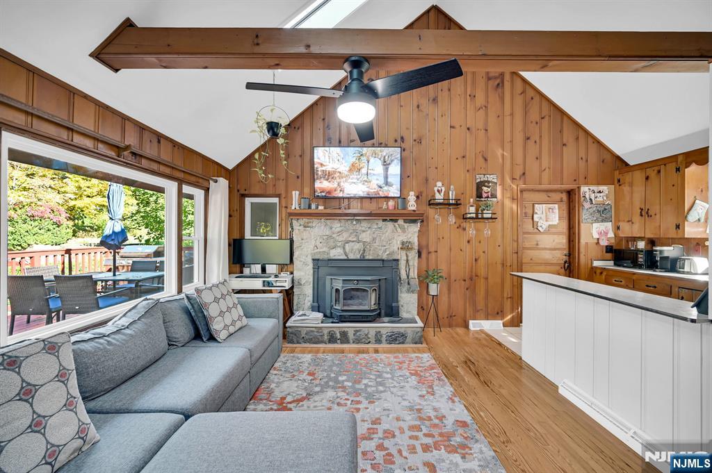85 Breakneck Road Vernon, NJ 07422 - Photo 5 of 32 a living room with furniture a large window and a fireplace