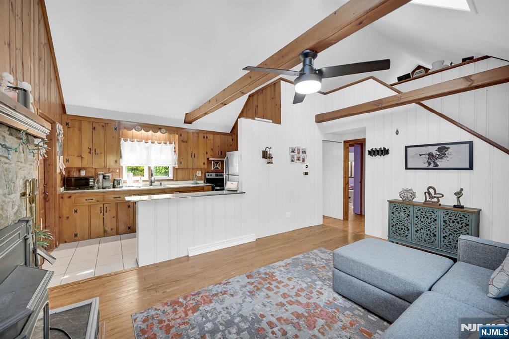85 Breakneck Road Vernon, NJ 07422 - Photo 7 of 32 a living room with stainless steel appliances furniture and a kitchen view