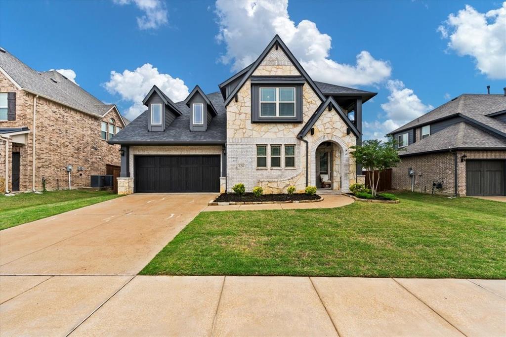 620 Shadow Trail Frisco, TX 75033 - Photo 2 of 36 Stone and siding exterior with dark trim accents