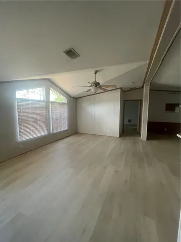 a view of an empty room with a window