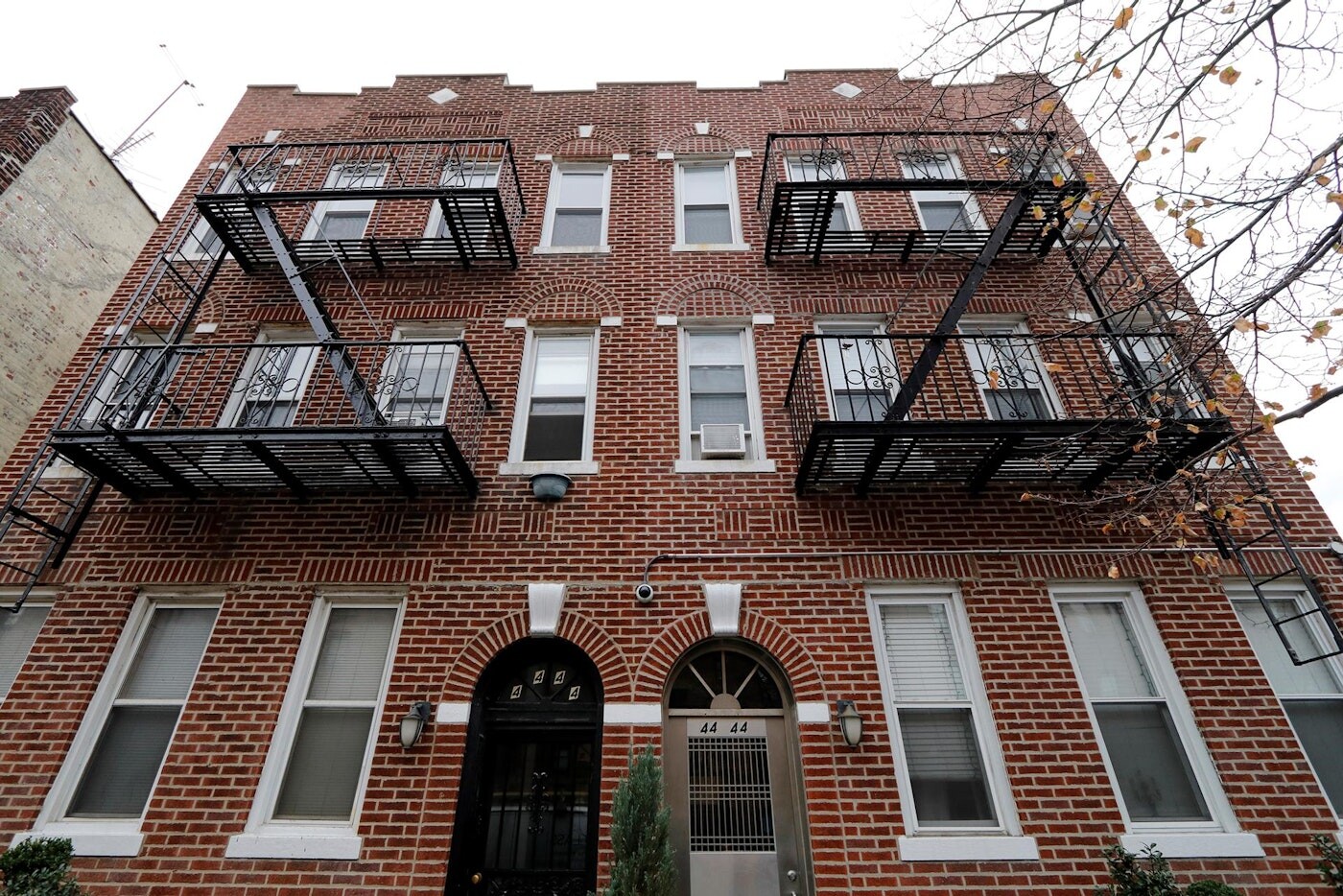 47-14 48th Street, Unit 1R Queens, NY 11377 - Photo 17 of 18 a view of a brick house with many windows