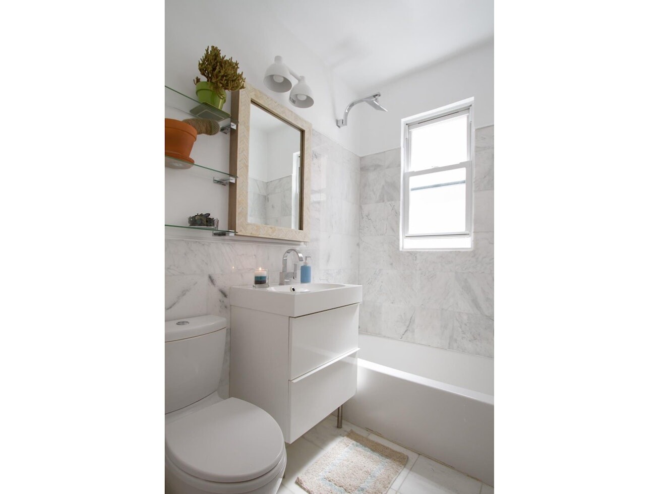 47-14 48th Street, Unit 1R Queens, NY 11377 - Photo 7 of 18 a bathroom with a sink a toilet and bathtub