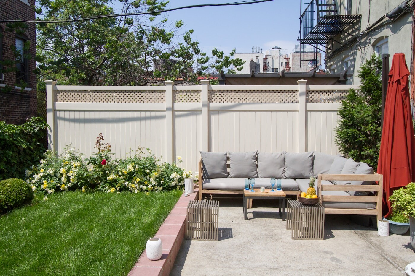 47-14 48th Street, Unit 1R Queens, NY 11377 - Photo 9 of 18 a view of a terrace with couches and a fire pit