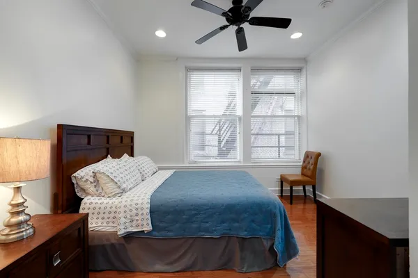 a bedroom with furniture and a window