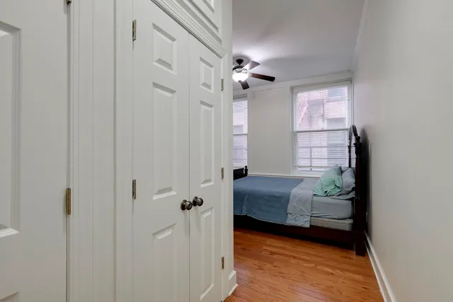 a bedroom with furniture and a window