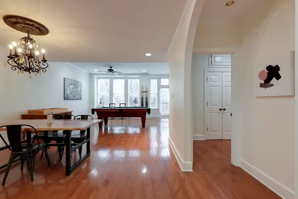 a view of a dining room with furniture and wooden floor