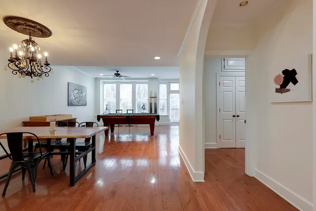 a view of a dining room with furniture and wooden floor