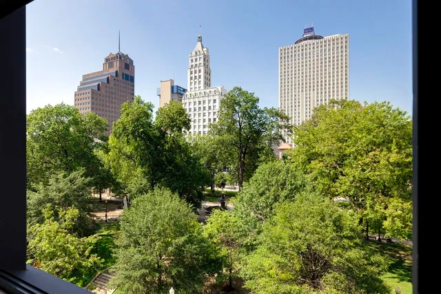 a view of a city with tall buildings