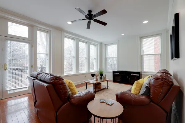 a living room with furniture and a large window