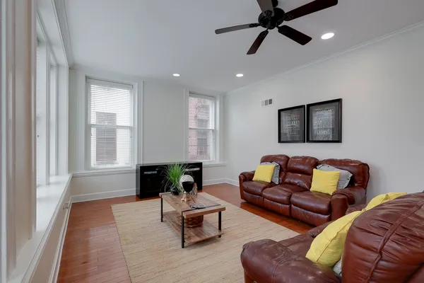 a living room with furniture and a window
