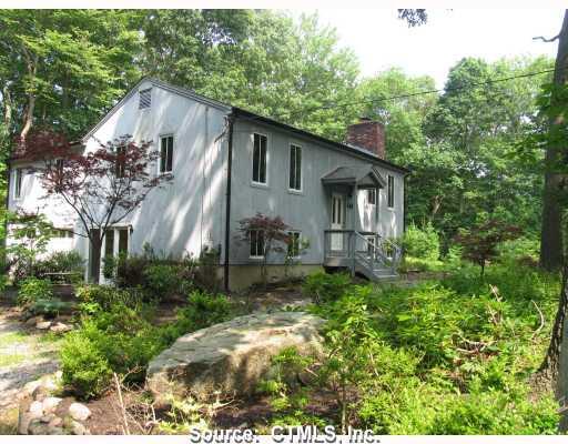 549 Mulberry Point Road Guilford, CT 06437 - Photo 1 of 1 a front view of house with a garden