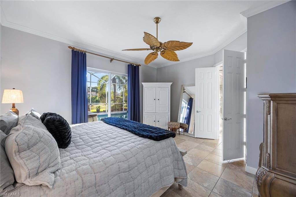 7534 Garibaldi Court Naples, FL 34114 - Photo 15 of 50 a bedroom with a bed and a window