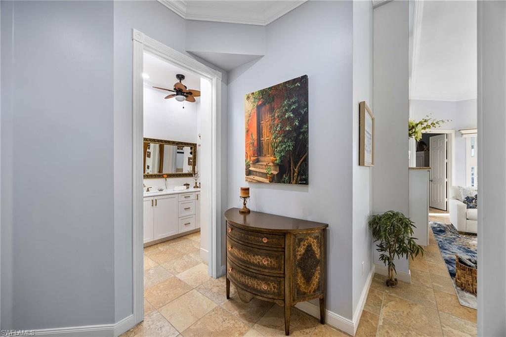 7534 Garibaldi Court Naples, FL 34114 - Photo 20 of 50 a view of a hallway and a livingroom with furniture