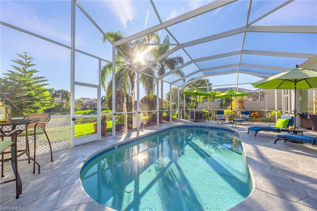 7534 Garibaldi Court Naples, FL 34114 - Photo 28 of 50 a view of swimming pool with outdoor seating
