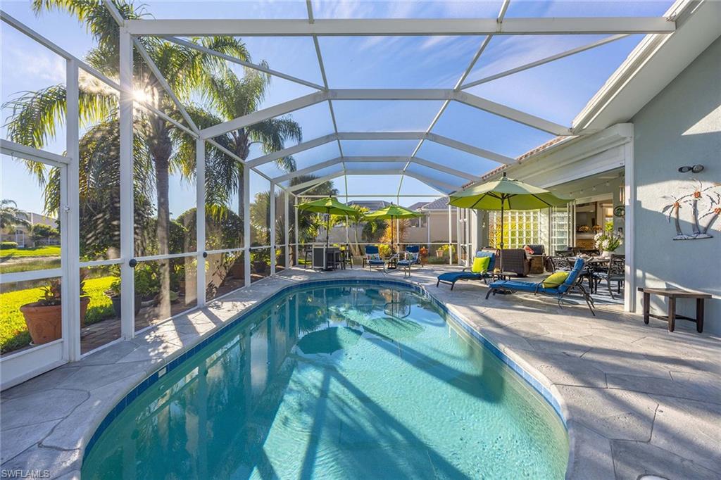 7534 Garibaldi Court Naples, FL 34114 - Photo 29 of 50 a view of a swimming pool with a patio