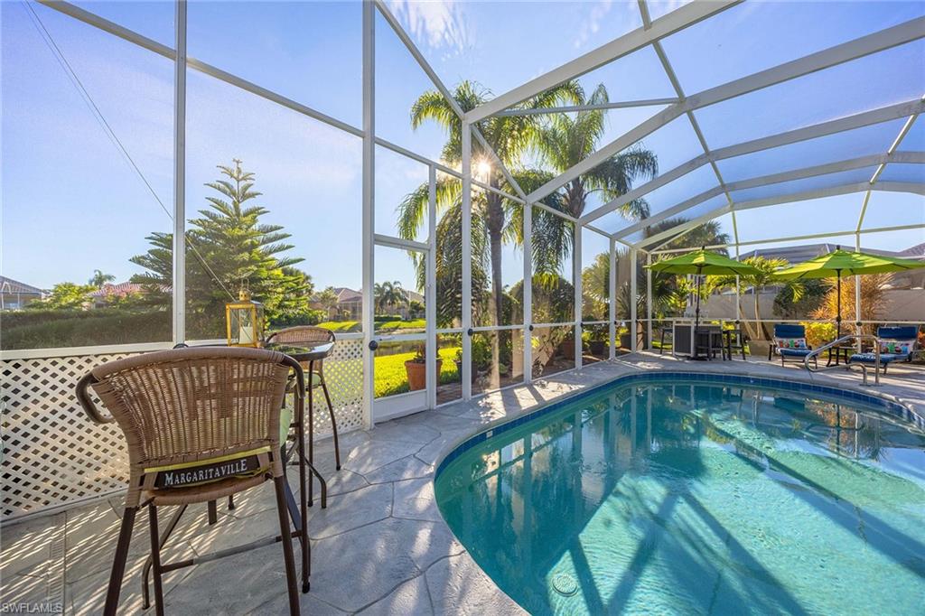 7534 Garibaldi Court Naples, FL 34114 - Photo 30 of 50 a view of a swimming pool with a patio