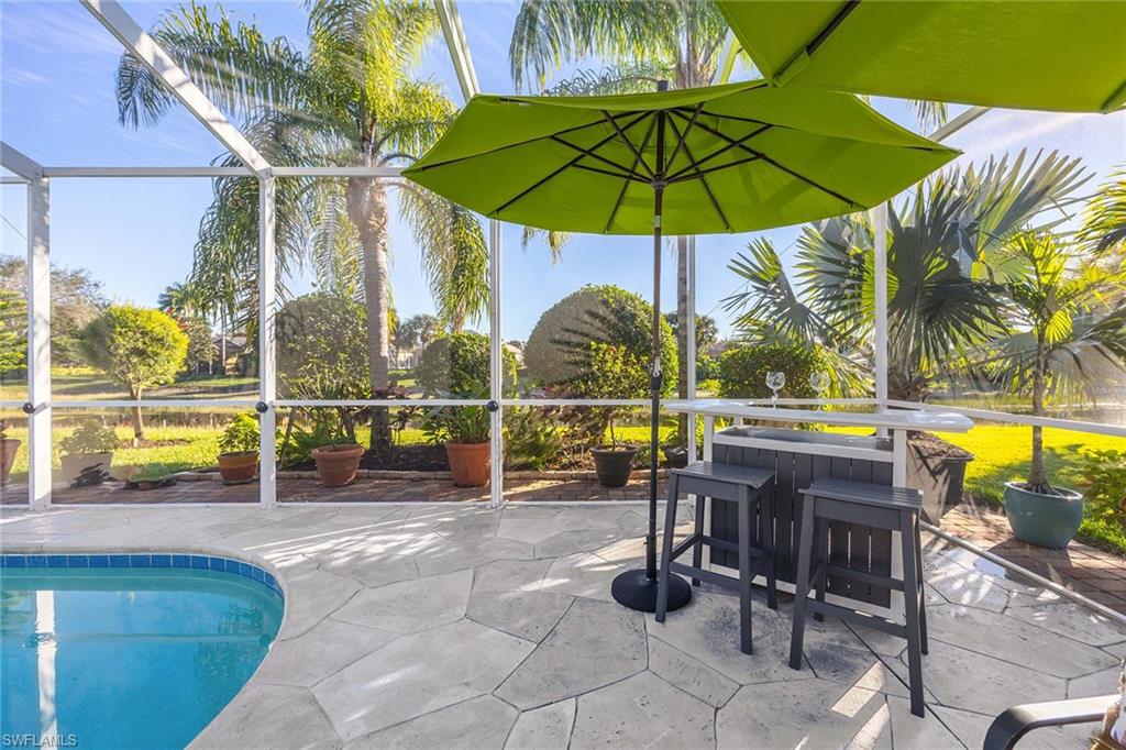 7534 Garibaldi Court Naples, FL 34114 - Photo 33 of 50 a view of a swimming pool with a lounge chair and swimming pool