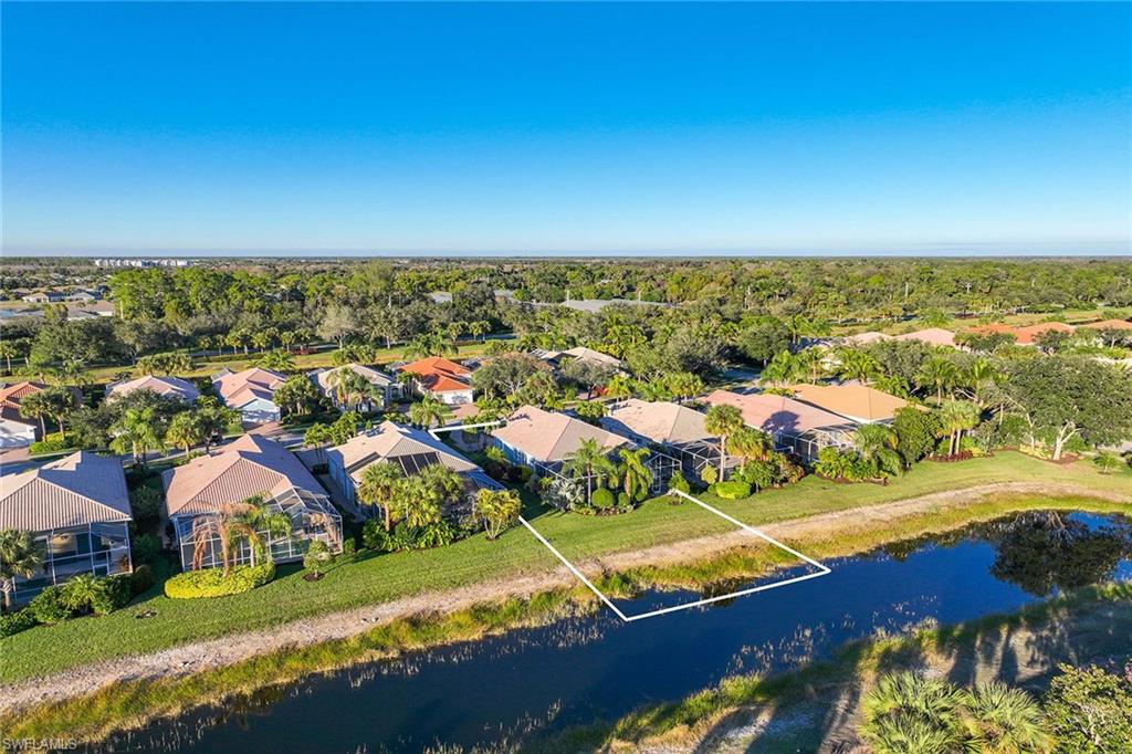 7534 Garibaldi Court Naples, FL 34114 - Photo 34 of 50 an aerial view of residential houses with outdoor space